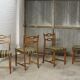 Ensemble de quatre chaises de salle à manger en chêne et laine par Henning Kjaernulf, années 1960.