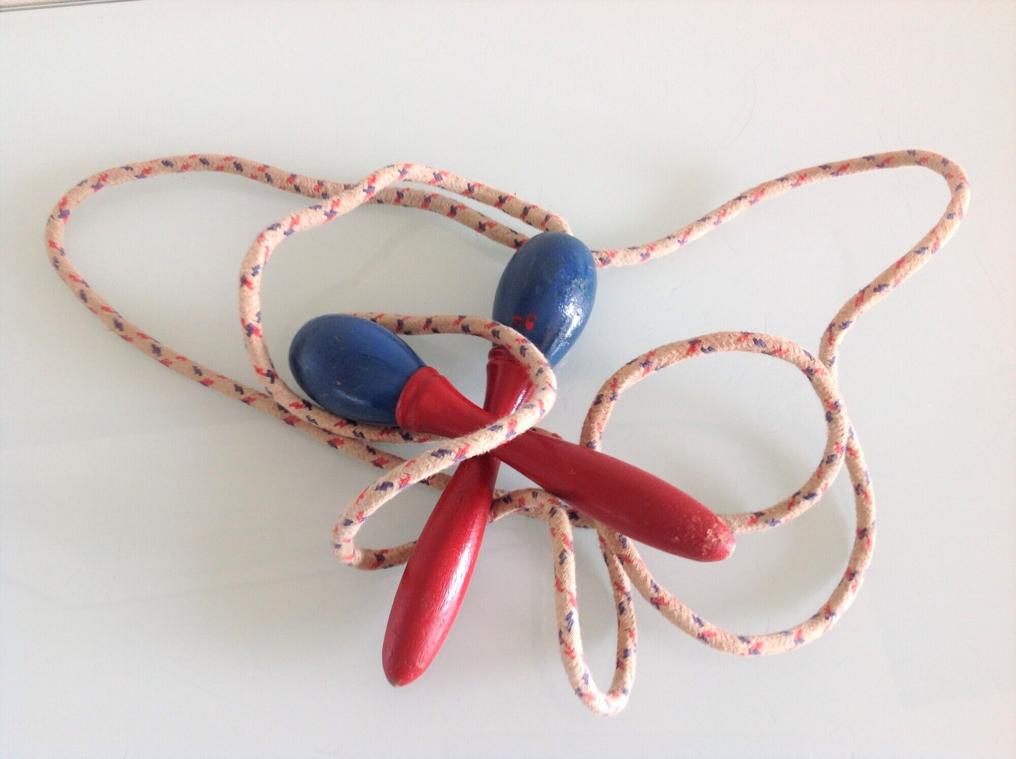 Old wooden jump rope red and blue / vintage