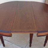 Extendable mahogany table with 6 tapered and fluted legs, Louis XVI style