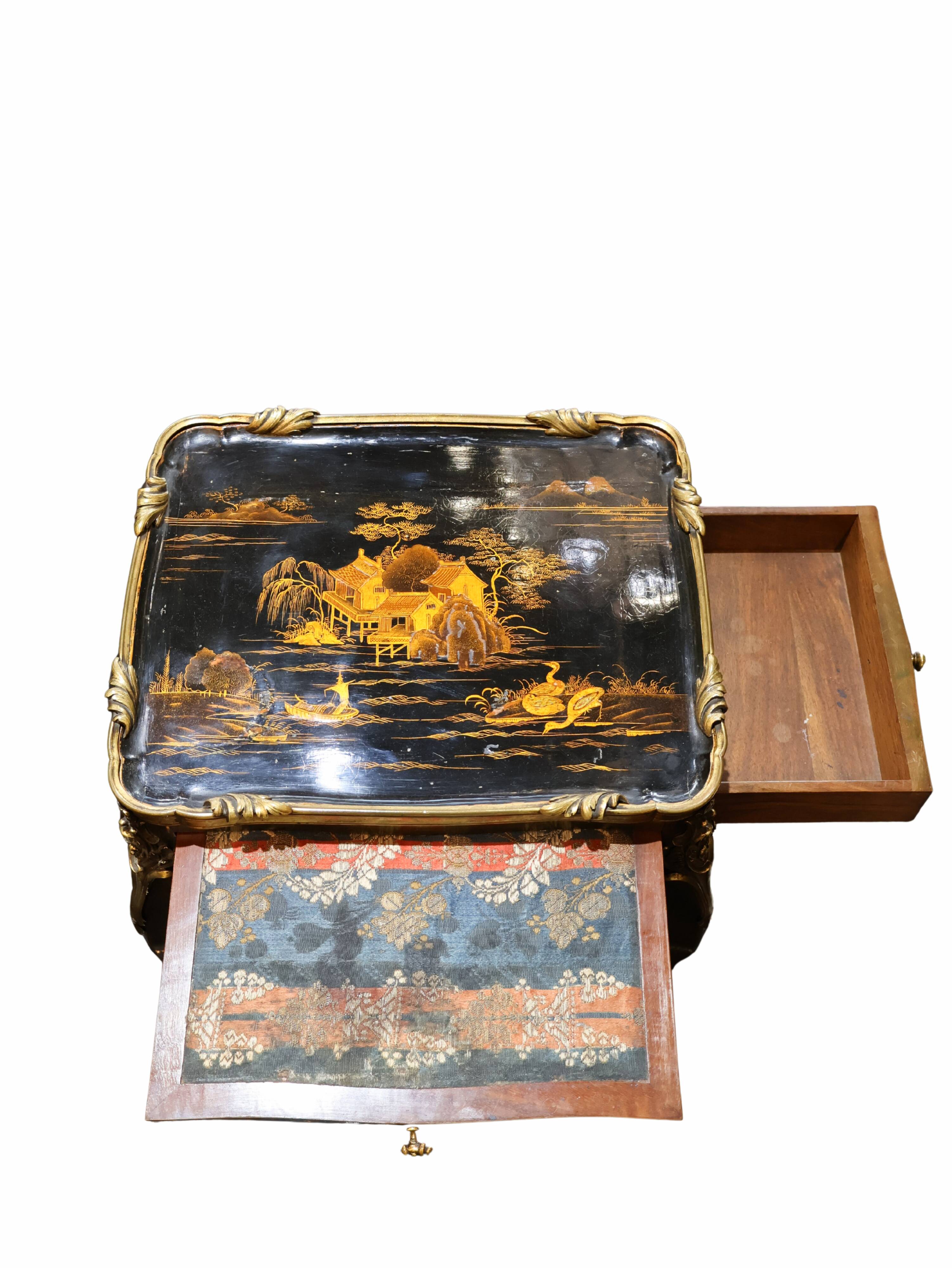 Japanese-style work table from the Napoléon III period in black lacquer and gilded bronze.