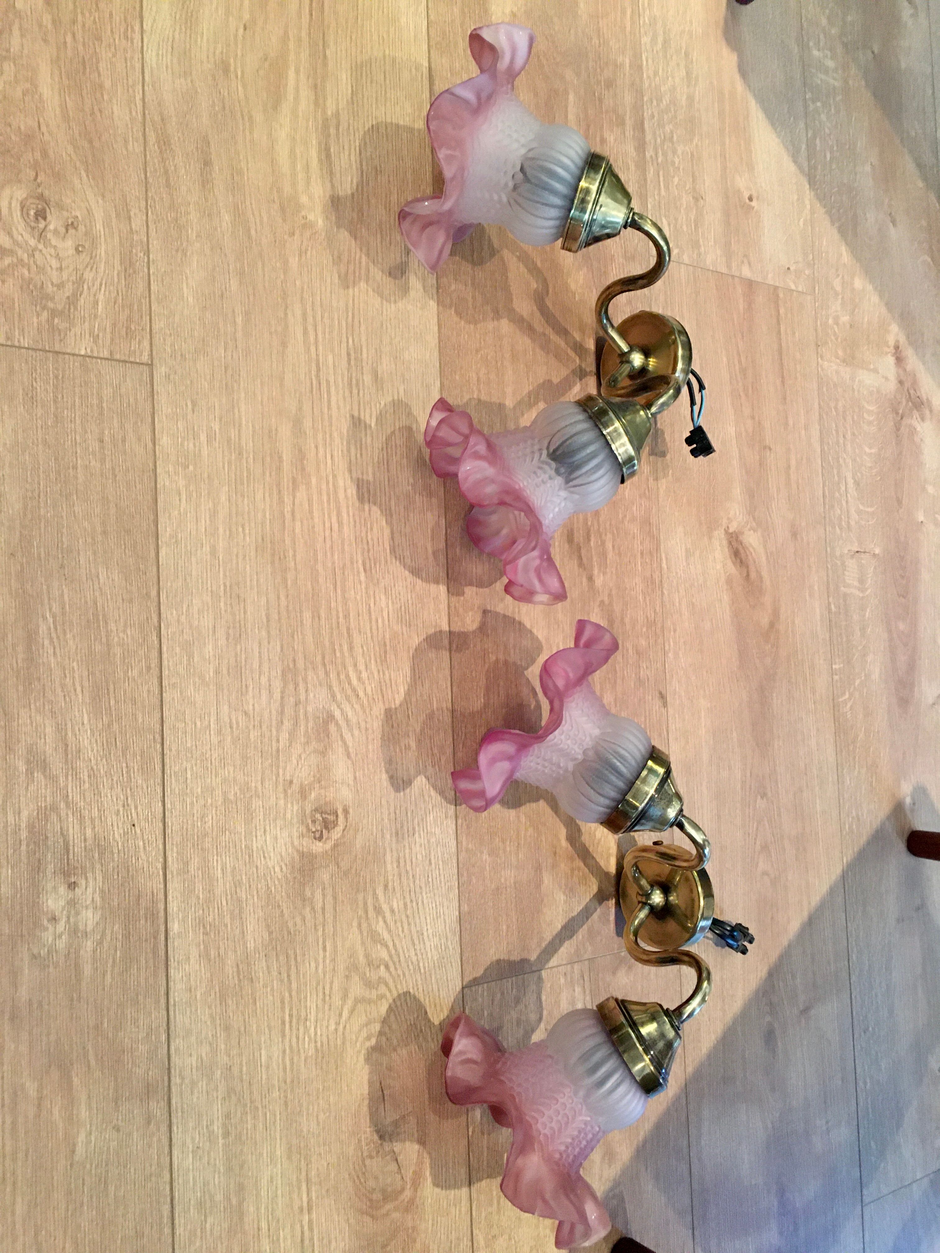 Pair of brass sconces and pink glass