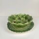 Leaf and strawberry-shaped bowl/strainer.