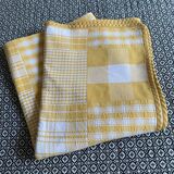 Vintage rectangular reversible cotton tablecloth with yellow and white Vichy checks and squares.