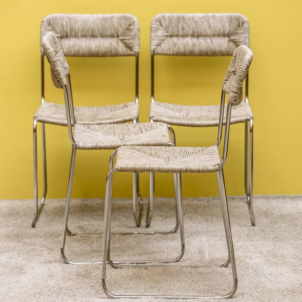 Four straw-seated chairs from 1980.
