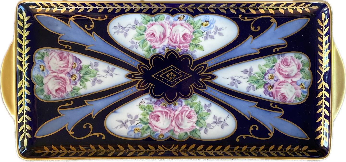 Plat décoratif en faïence de Limoges