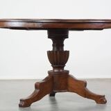 Wooden round 4-person dining table with detailed leg