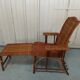 Sunbathing sunbathing in wicker rattan wood deckchair red lounger