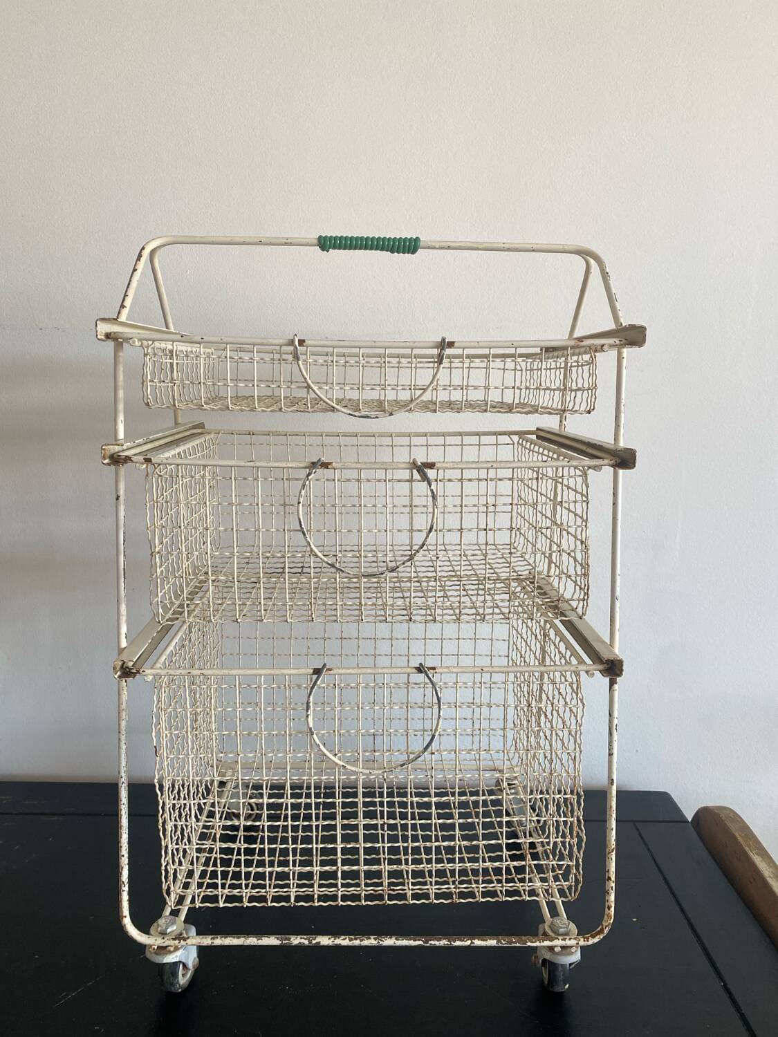 Metal serving trolley on wheels