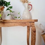 Antique coffee table with curved legs.