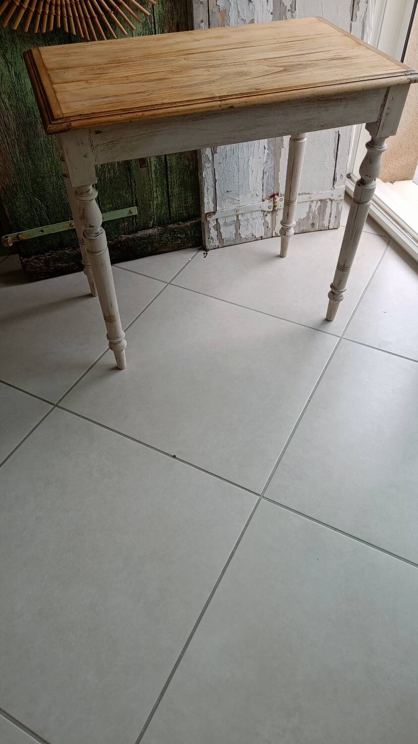 Antique wooden desk with a patinated base