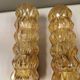 A set of Danish wall lights in champagne coloured glass with brass and teak.