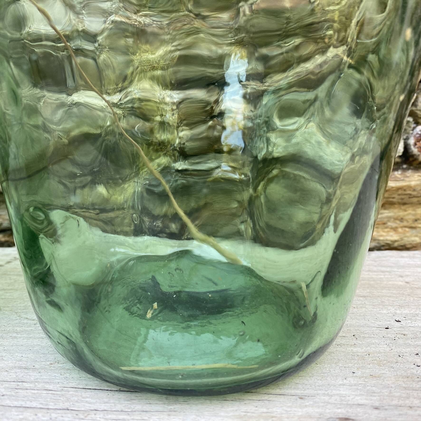 set of tinted glass demijohns
