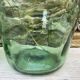 set of tinted glass demijohns