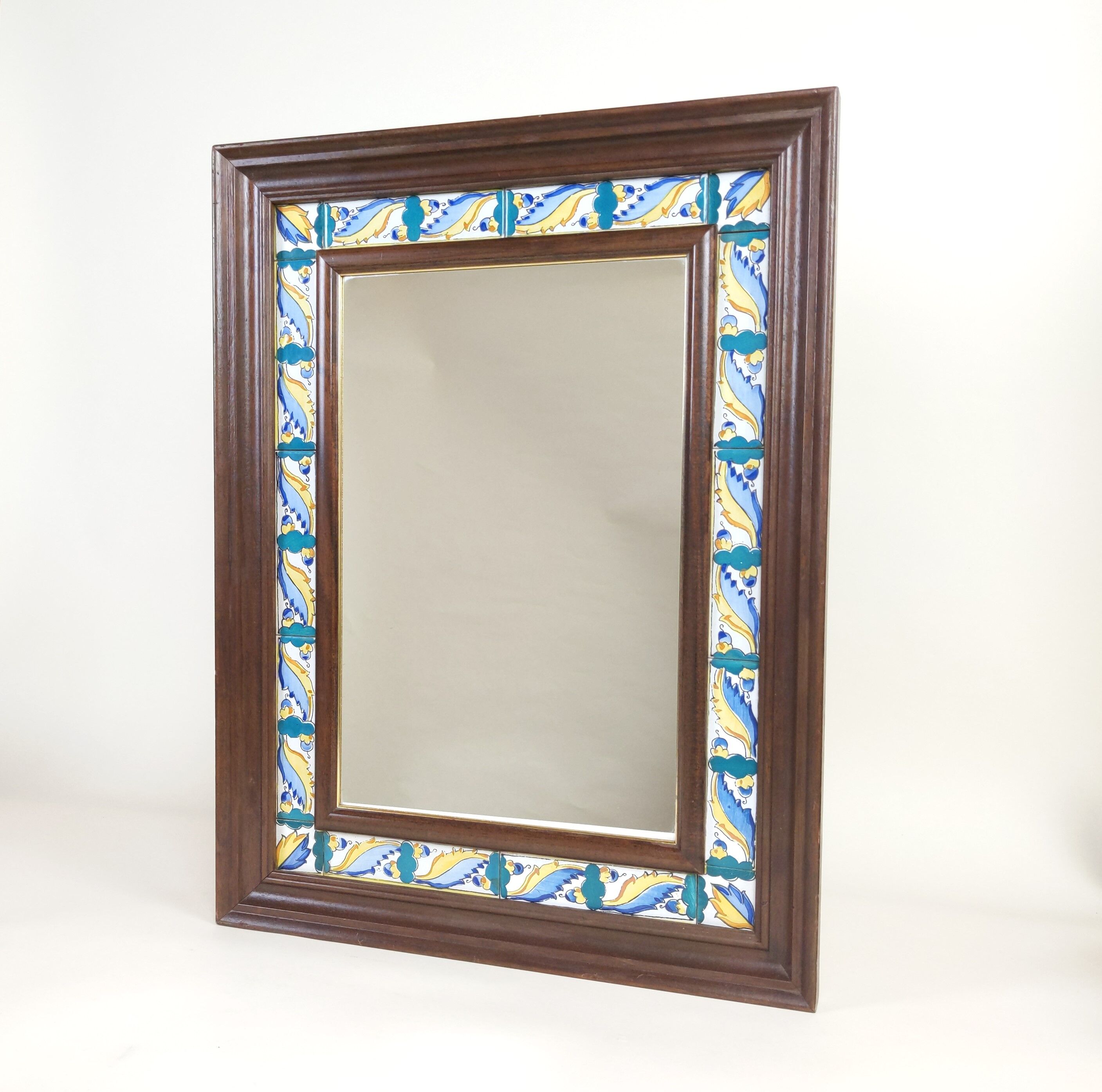 Mirror with wooden frame and painted ceramic tiles
