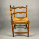 Chaise d'angle vintage en bois avec assise en paille tissée