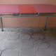 Vintage table of the 60s in red formica and chrome legs