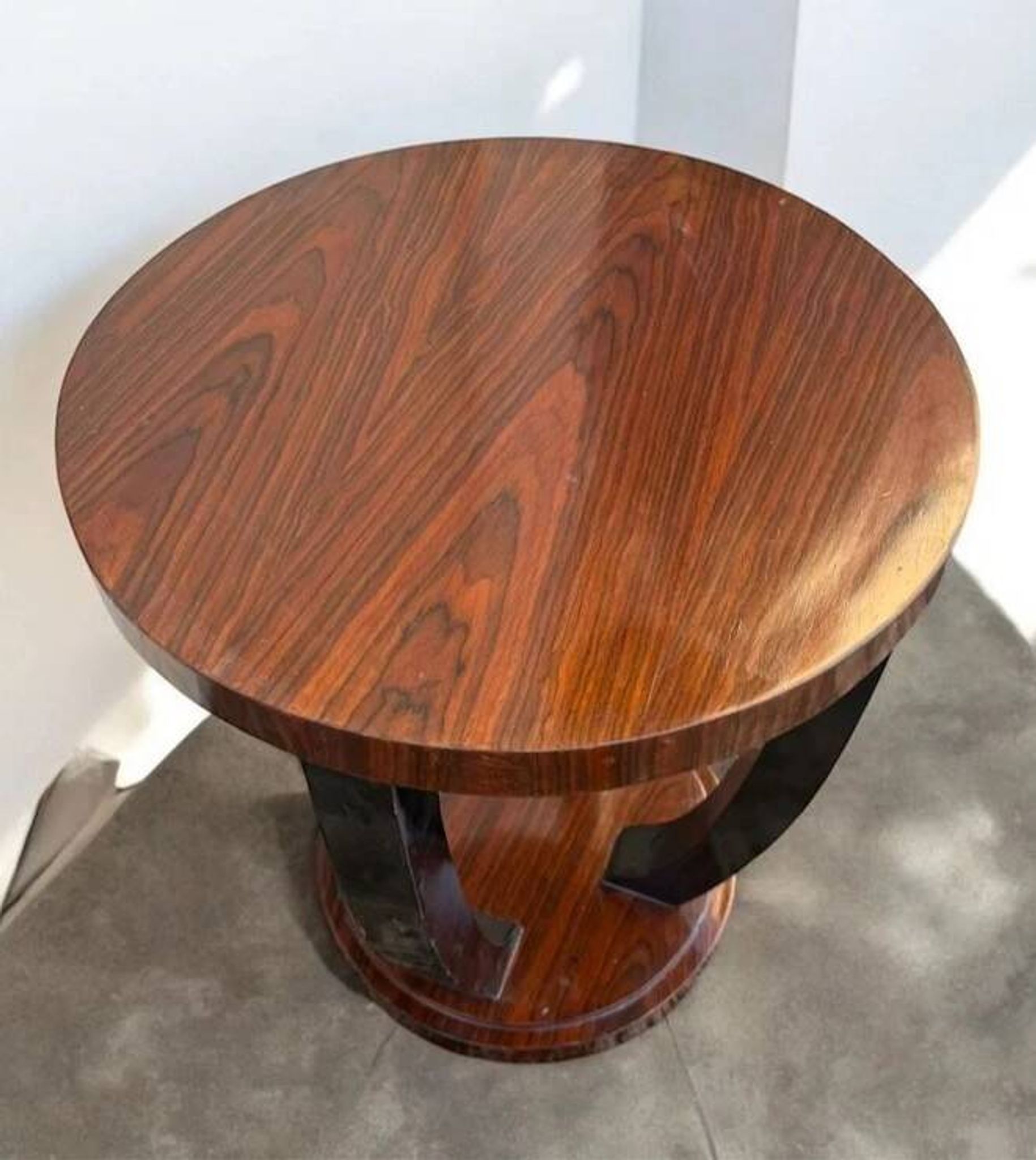 A round Art Deco coffee table made of beech wood and rosewood.