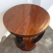 A round Art Deco coffee table made of beech wood and rosewood.