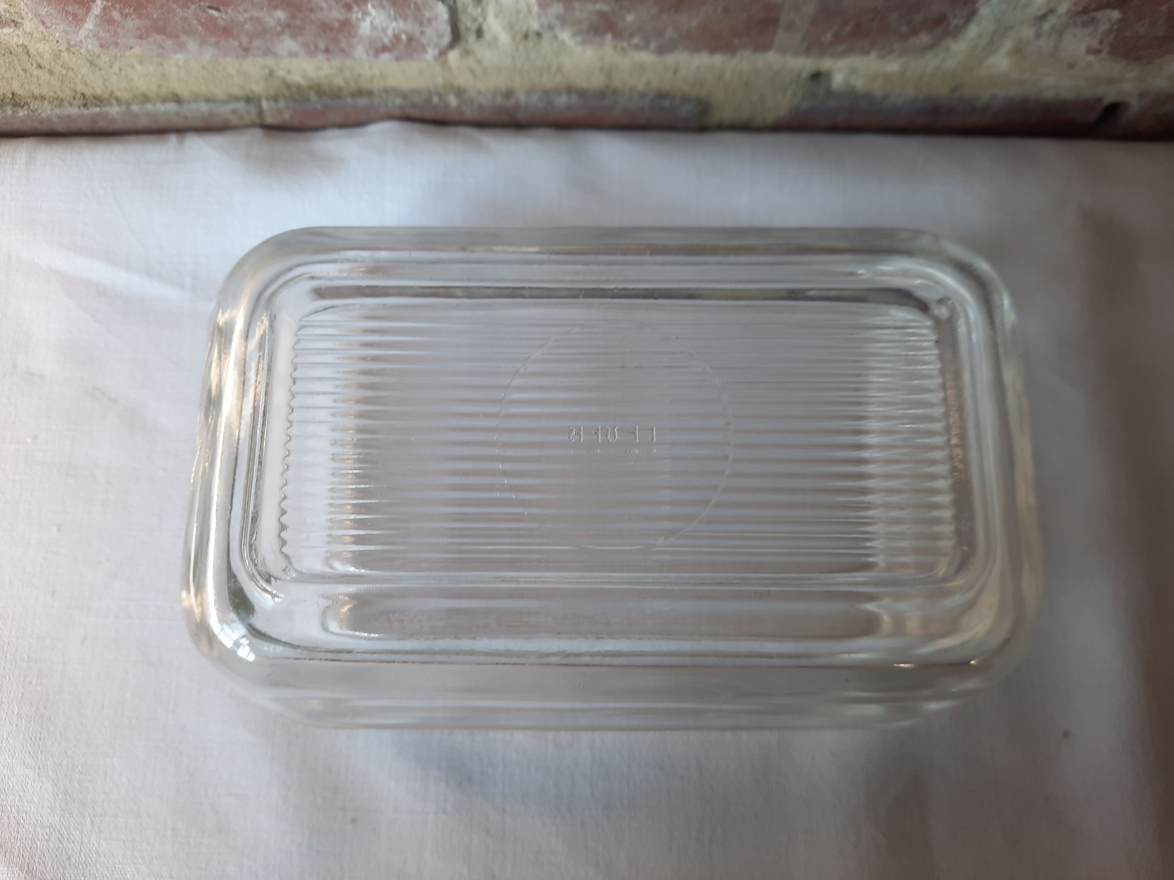 Transparent glass butter dish from lever