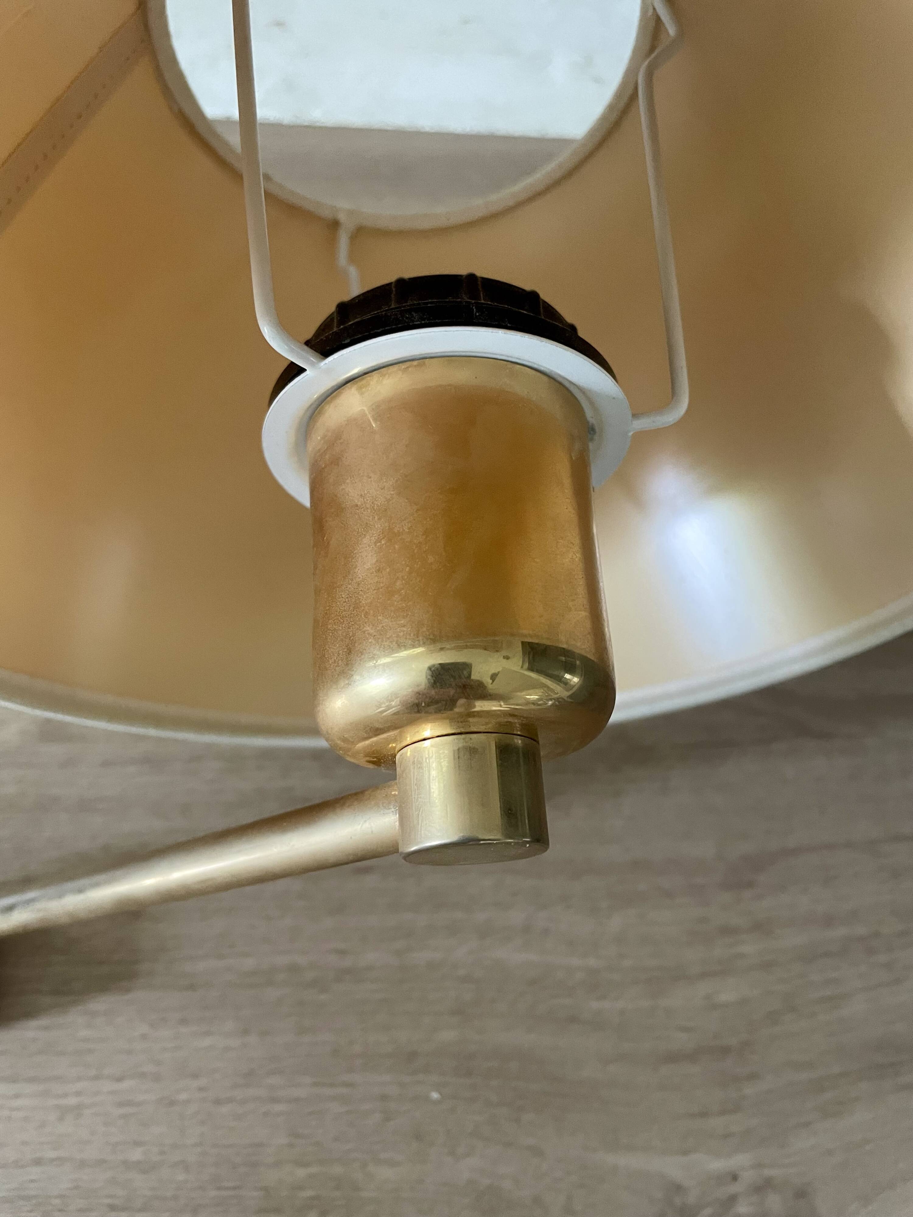 Pair of vintage brass wall lights with adjustable arms.