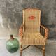 Vintage braided rattan armchair