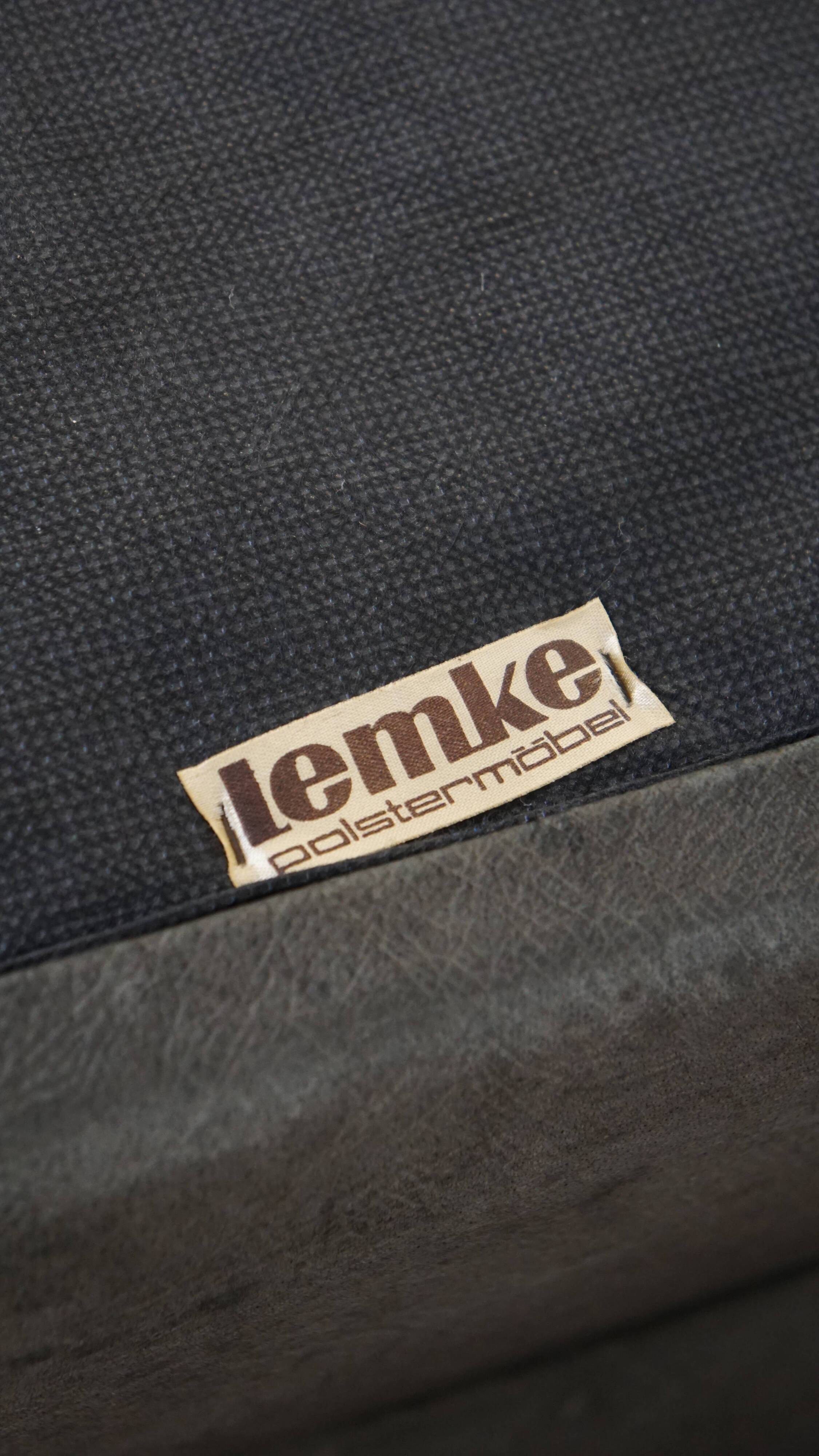 Canapé design modulable en cuir gris, 3 modules et 1 repose-pieds