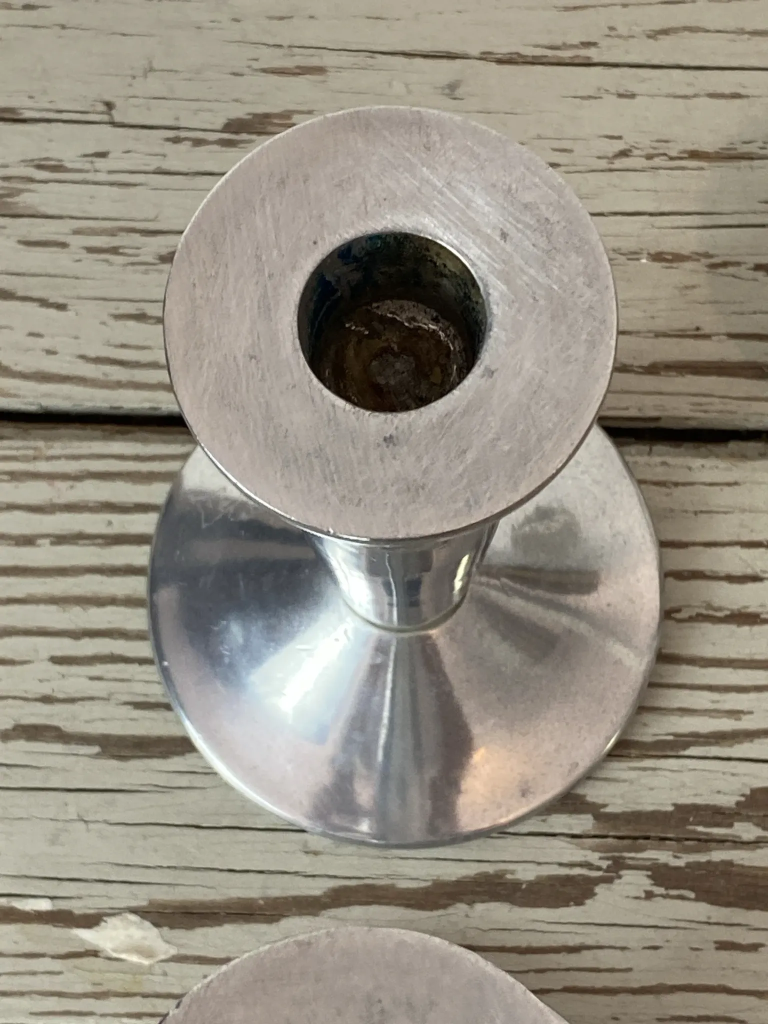 Pair of minimalist polished aluminium candle holders
