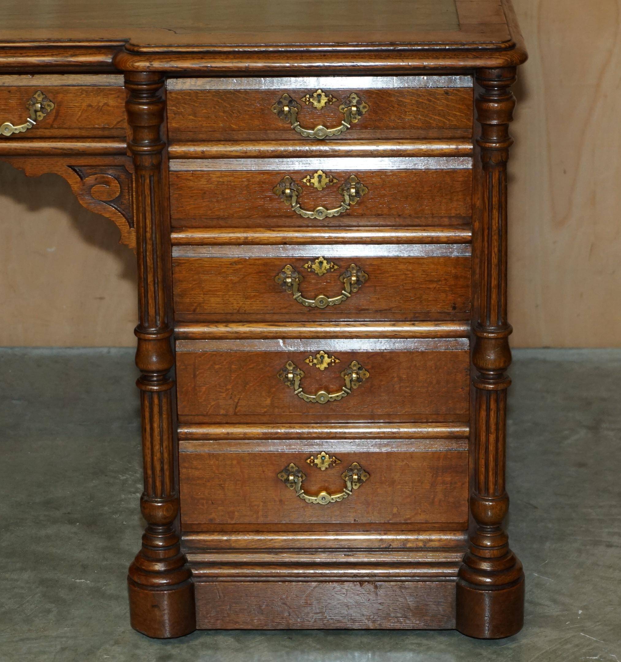 Antique double-sided desk C Hindley & Son in oak and leather