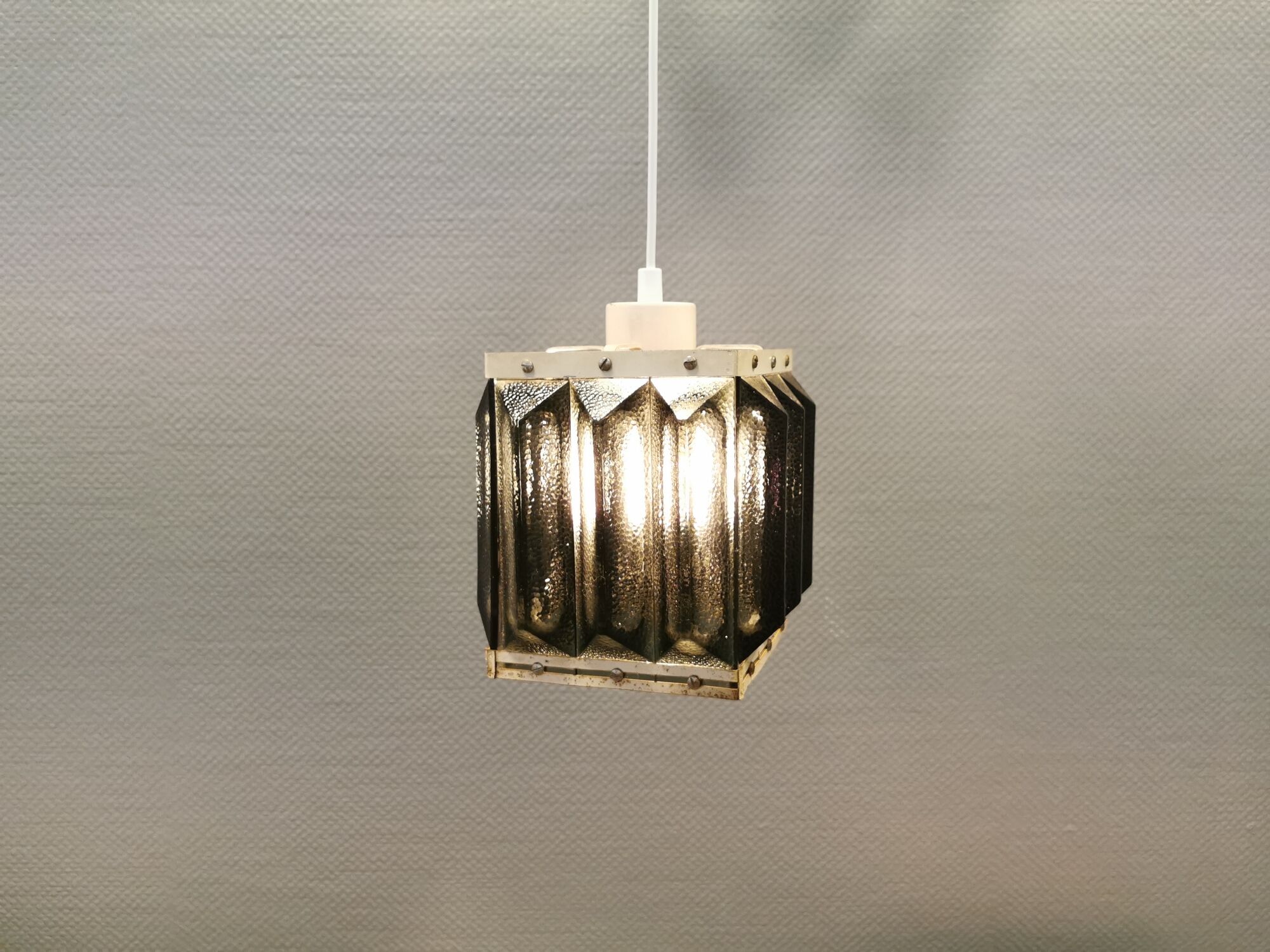 Old Swedish lamp made of metal and smoked solid glass pieces.