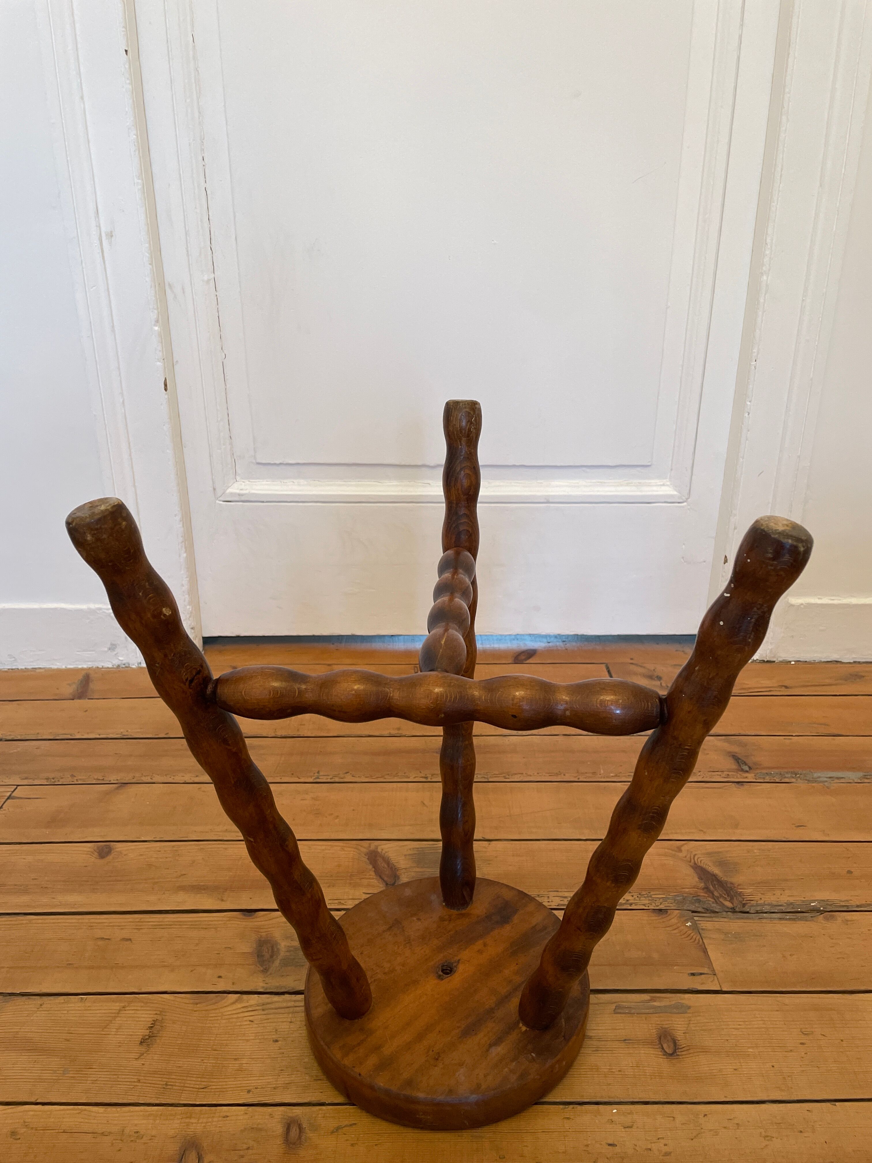Old wooden tripod stool