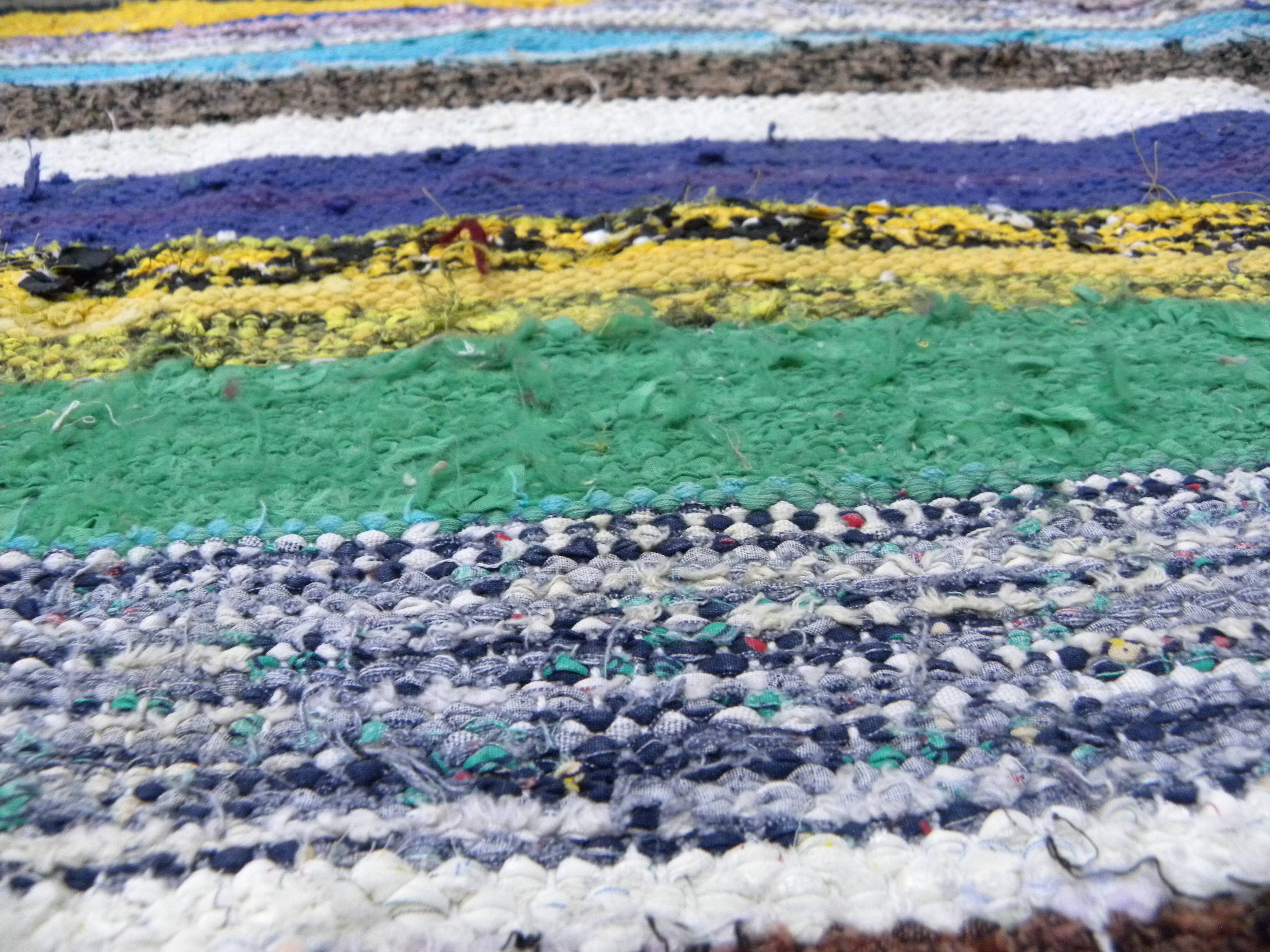 Vintage traditional nomadic kilim ethnic rug with multicoloured stripes.