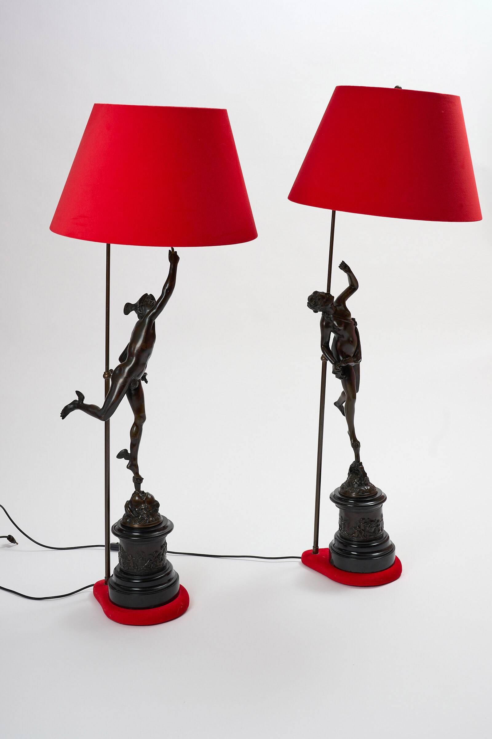 Pair of bronze lamps with red shades