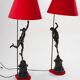 Pair of bronze lamps with red shades