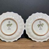 Pair of plates with floral decoration in Nevers earthenware signed Montagnon