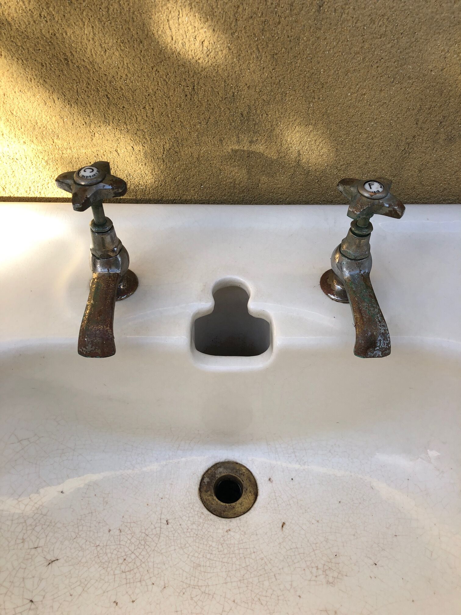 Antique washbasin on ceramic column
