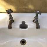 Antique washbasin on ceramic column