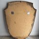 Brass mirror with crest, bead frieze, Italian design style.