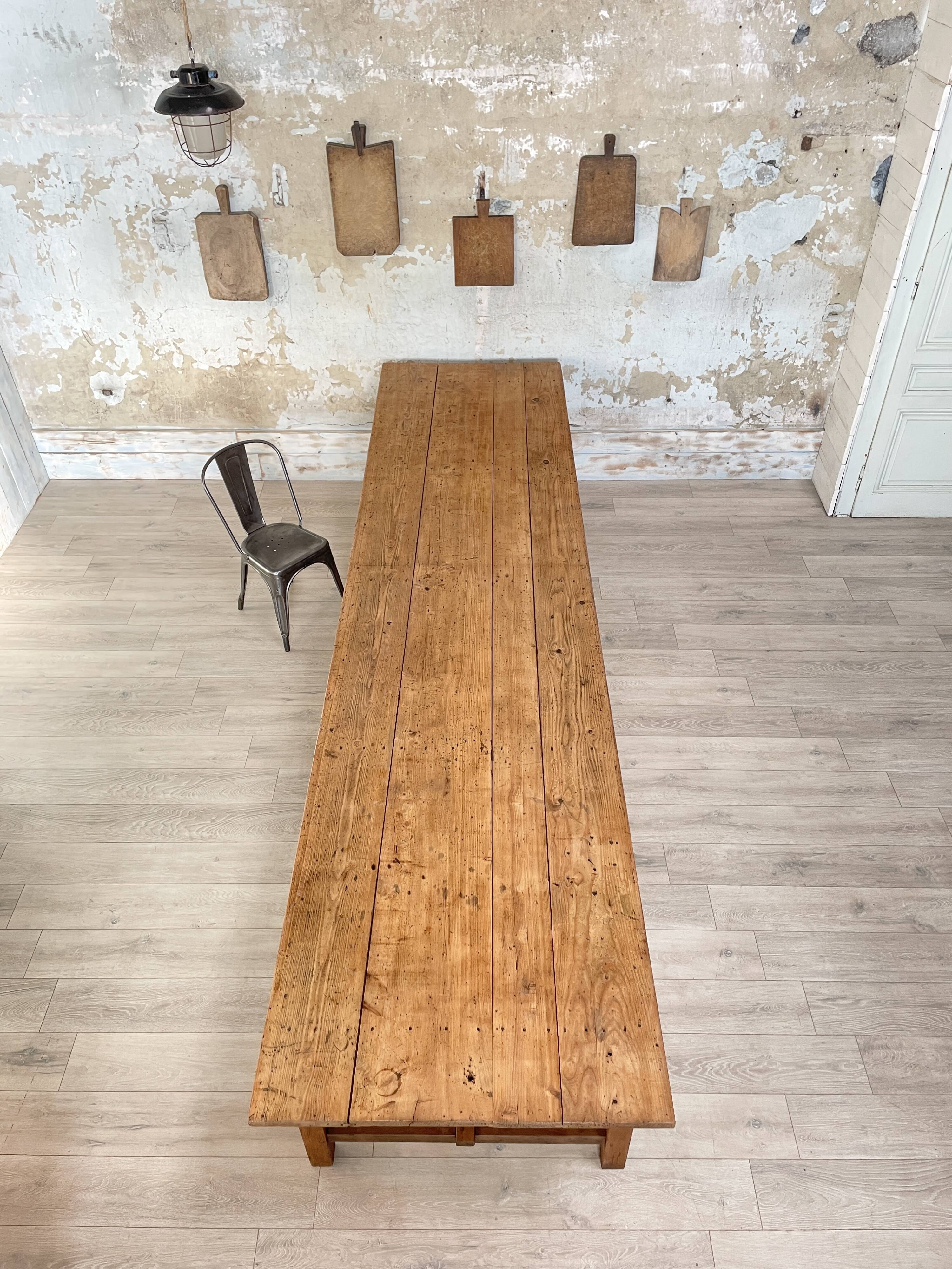 Solid wood workshop table with straight legs.