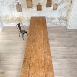 Solid wood workshop table with straight legs.