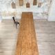Solid wood workshop table with straight legs.