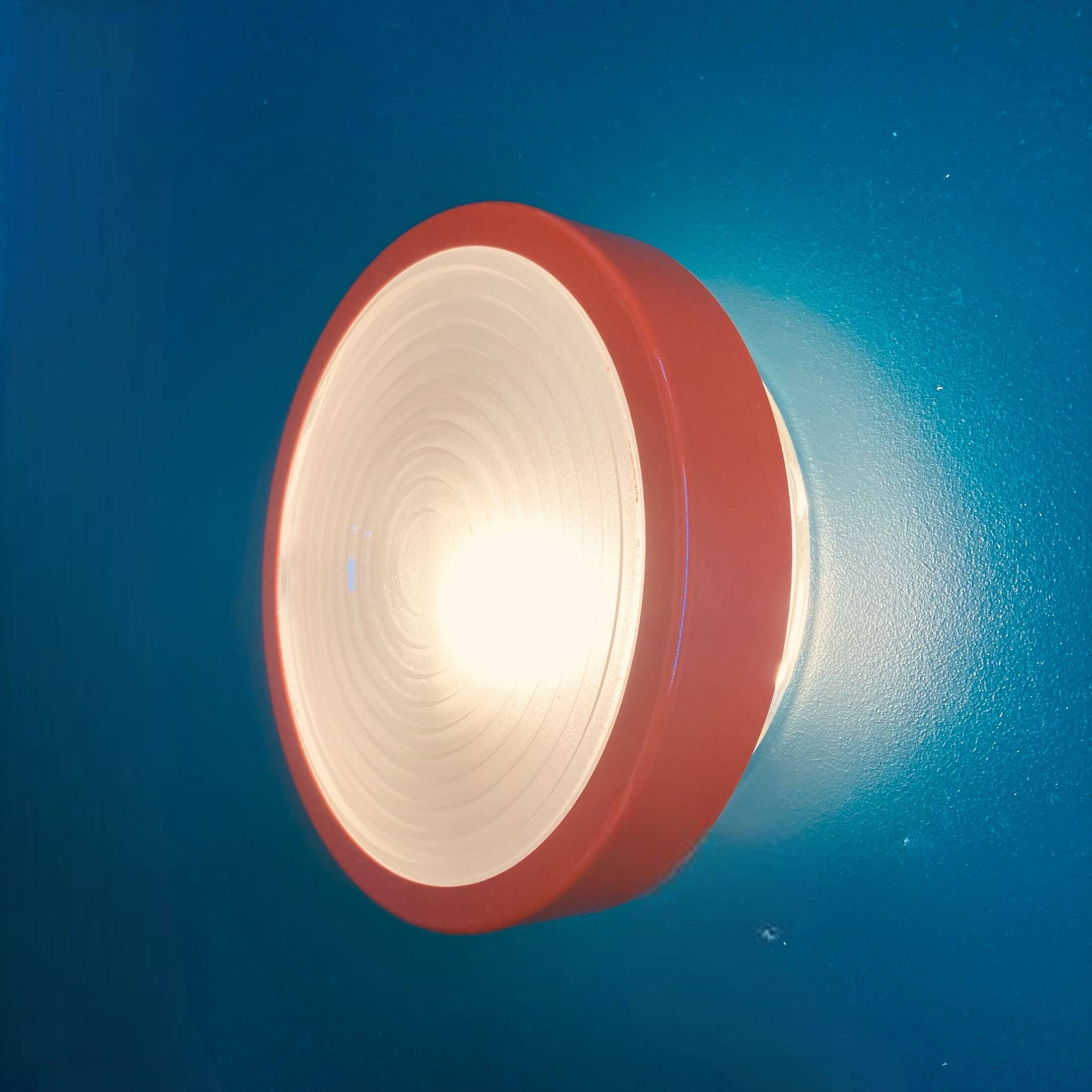 Large round Holophane wall lamp in glass and orange metal, industrial vintage decoration