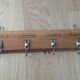 Tea towel holder, wooden and metal towel hook.