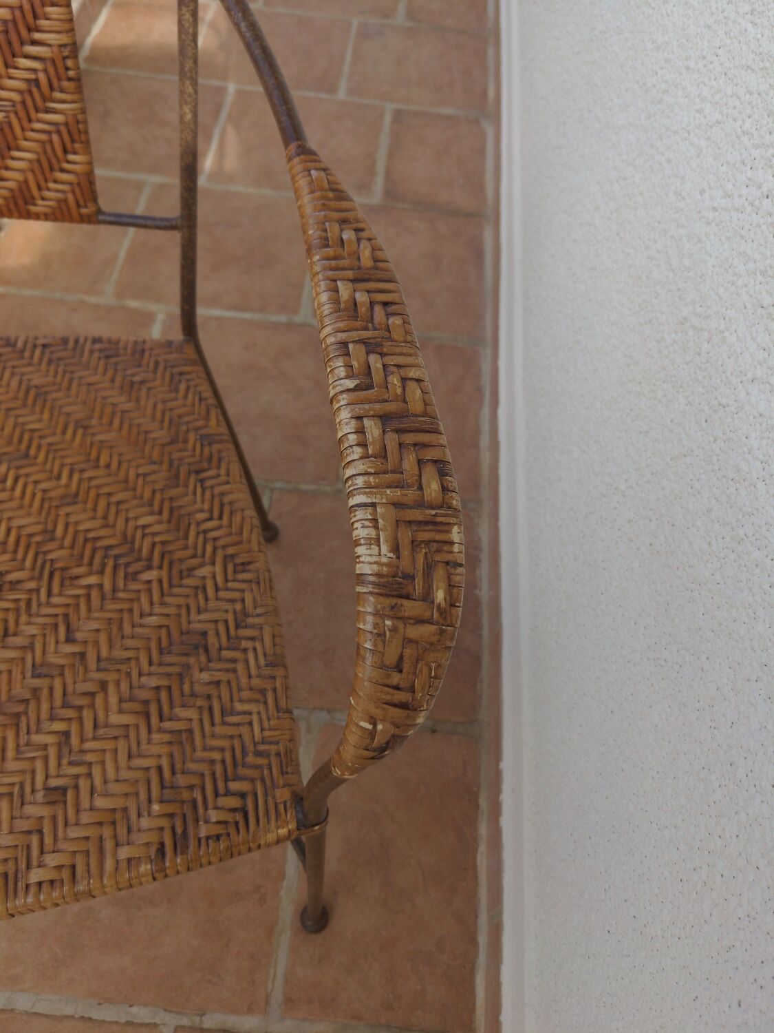 Wicker armchair and wrought iron