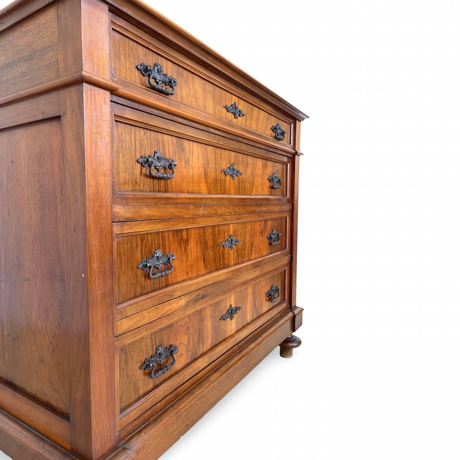 Antique walnut commode with bronze handles in the shape of a lion's mask,