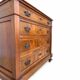 Antique walnut commode with bronze handles in the shape of a lion's mask,
