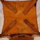 Antique Art Nouveau pedestal table with carved wood and marble top.