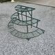 Old half-moon wrought iron plant holder