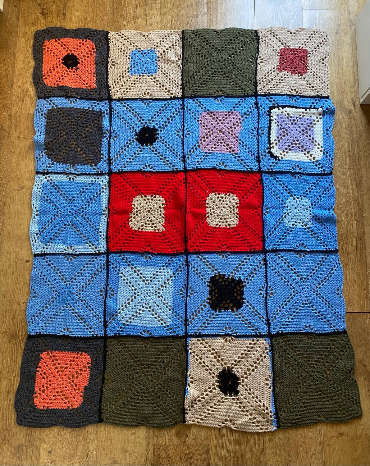 Hand-knitted patchwork blanket