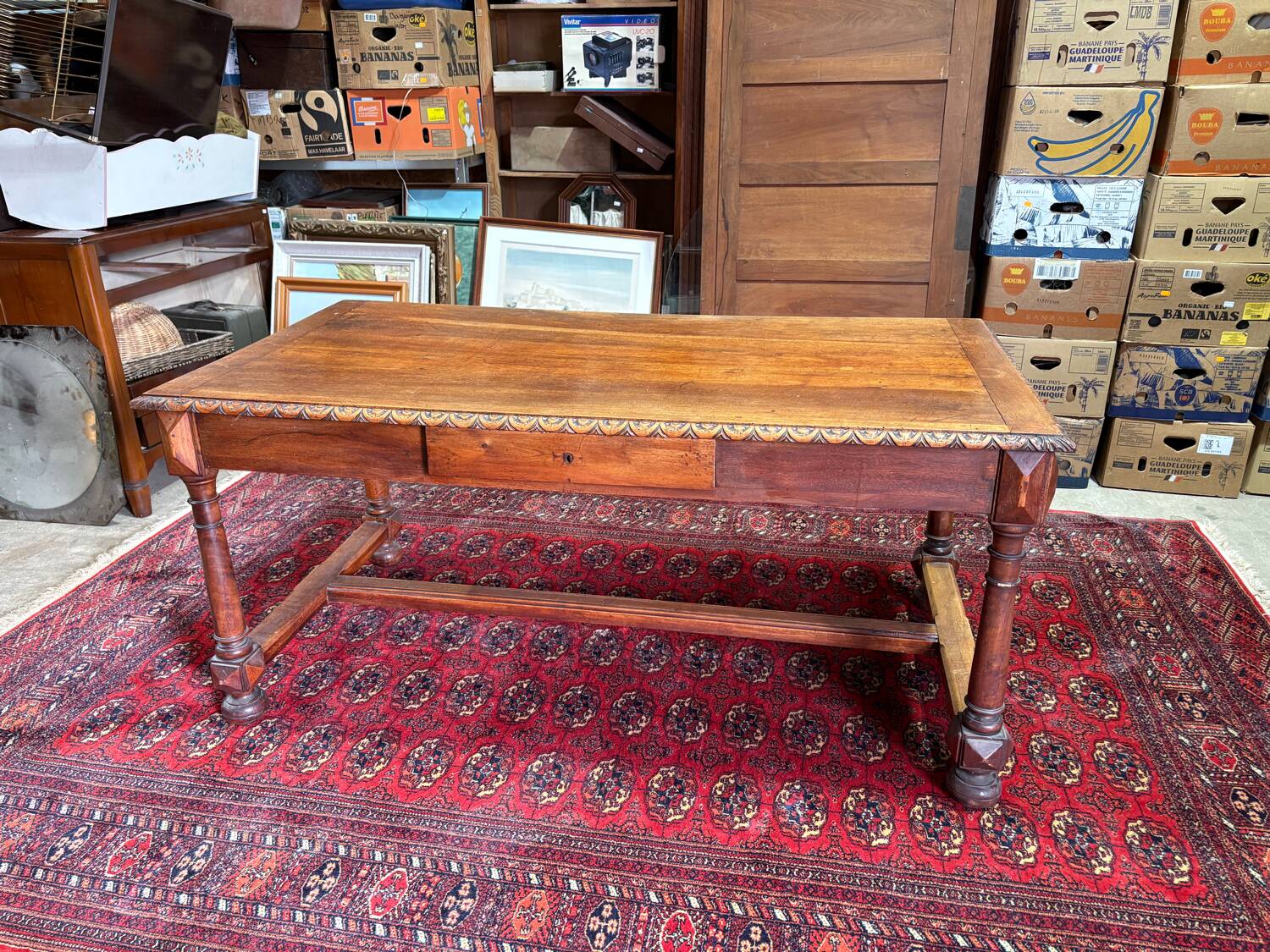 Large antique carved wooden desk in Renaissance style