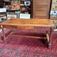 Large antique carved wooden desk in Renaissance style